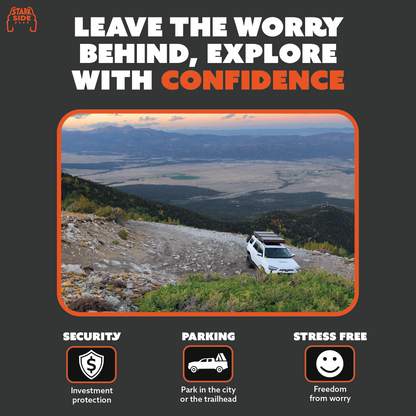 A vehicle parked at a mountain overlook with the tent locked on the roof