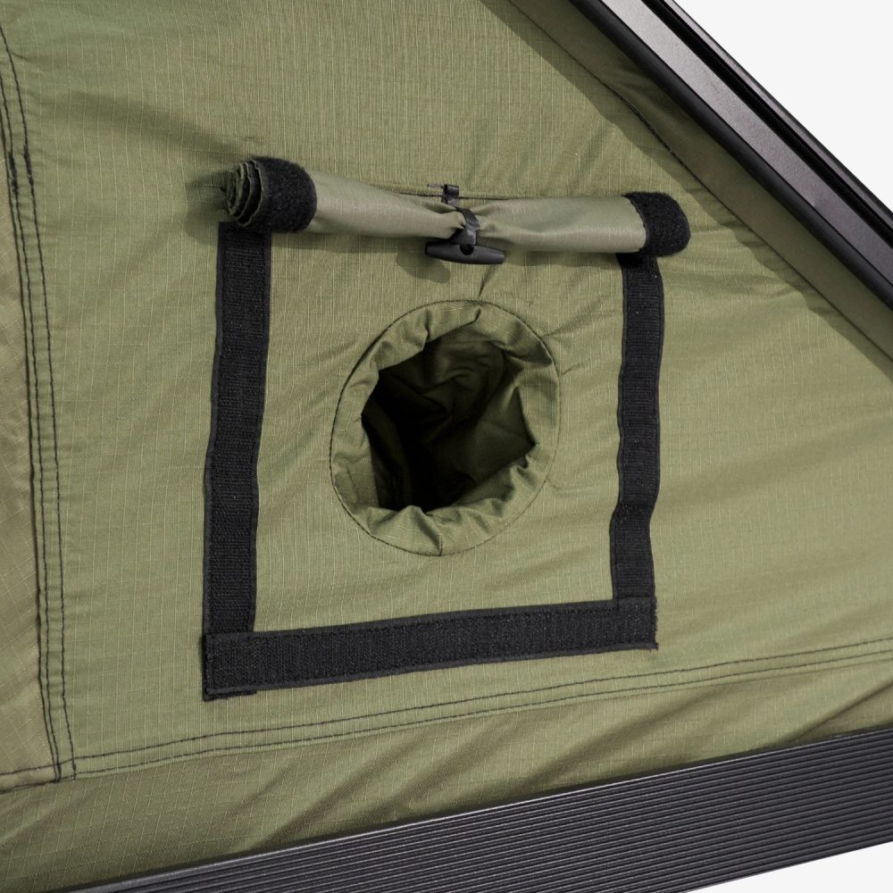 Round port in the Carbonlite tent wall with its rolled cover strapped above it