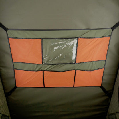 Interior storage panel in the Carbonlite with orange mesh pockets and a clear window pocket