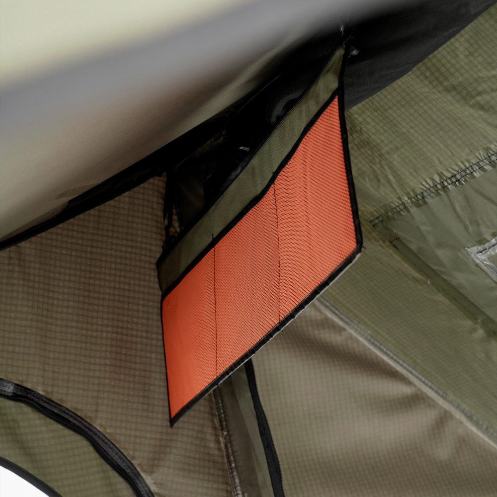 Hinged orange-lined flap open inside the Carbonlite at the top of the tent wall