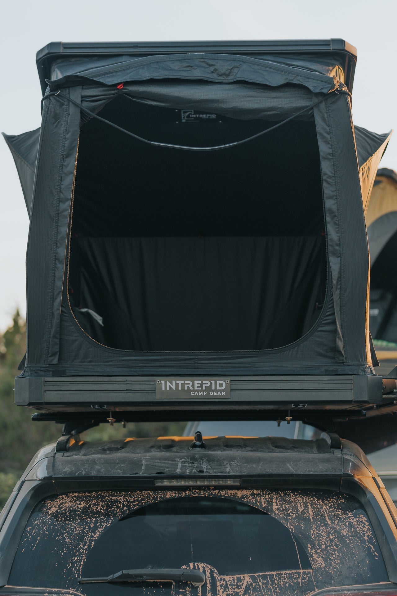 Rear mesh door of the Intrepid Geo 2.0, open on a dusty vehicle