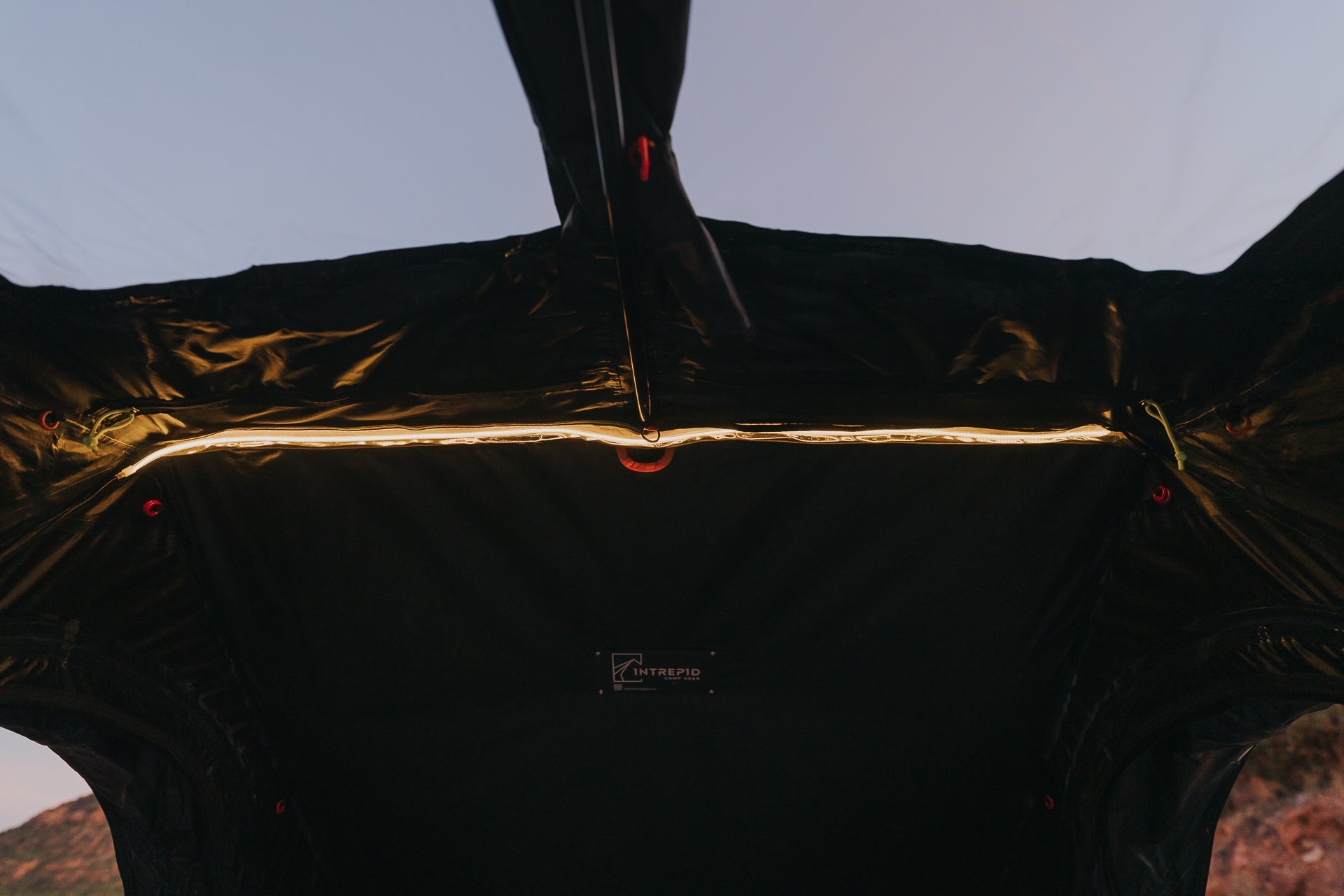 Inside the Intrepid Geo 3.0 Pro, the ceiling panel unzipped to a strip of sky