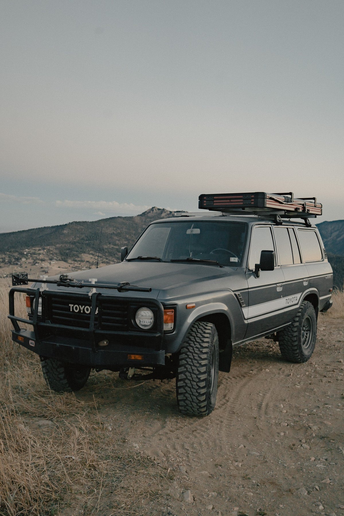 Intrepid Geo Solo closed on a Toyota Land Cruiser, front three-quarter view