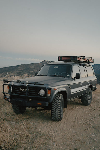 Intrepid Geo Solo closed on a Toyota Land Cruiser, front three-quarter view