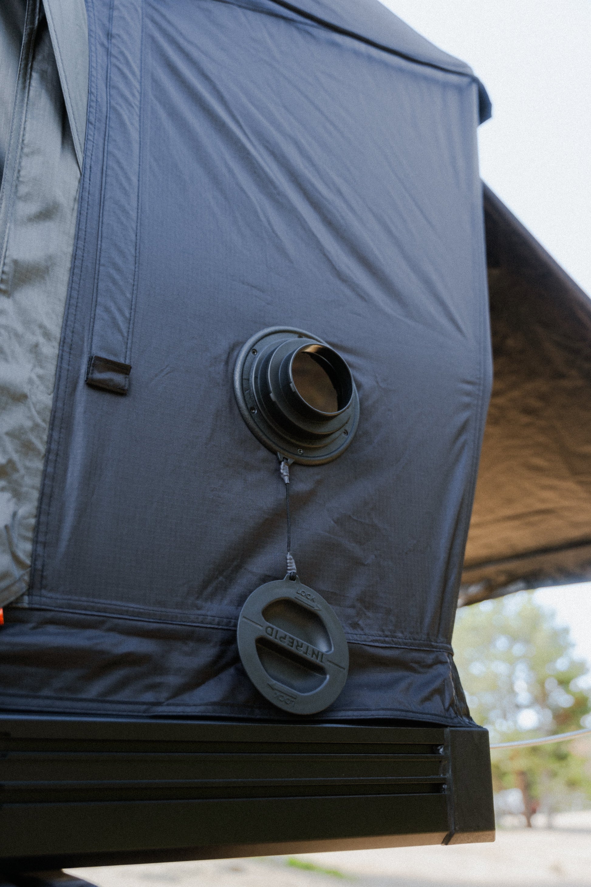 Heater port open on the Intrepid Geo 3.0 Pro side wall, its cap hanging on a lanyard