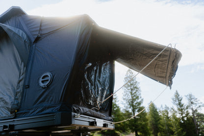 Rear awning extended on the Intrepid Geo 3.0 Pro, with the port and window on the side wall