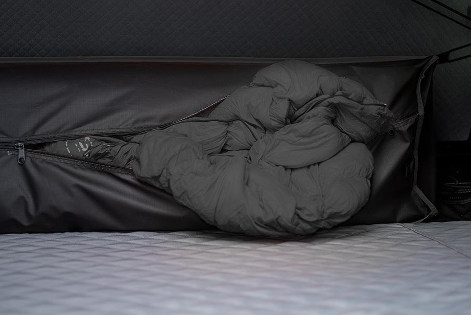 Bedding stored inside the closed Roofnest Condor 2 shell