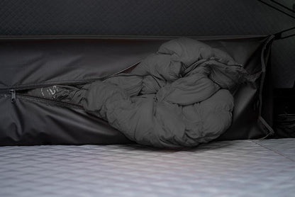 Bedding stored inside the closed Roofnest Condor 2 shell