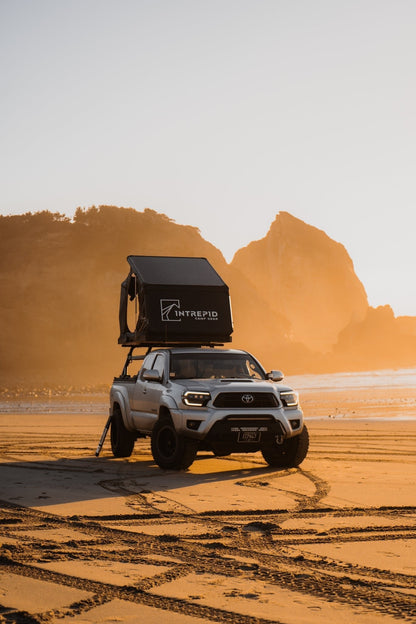 Intrepid Geo 2.5 closed on a Toyota Tacoma at sunrise on a beach