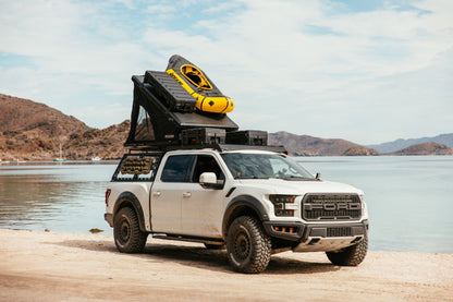 ROAM Desperado closed on a Ford Raptor at the water’s edge