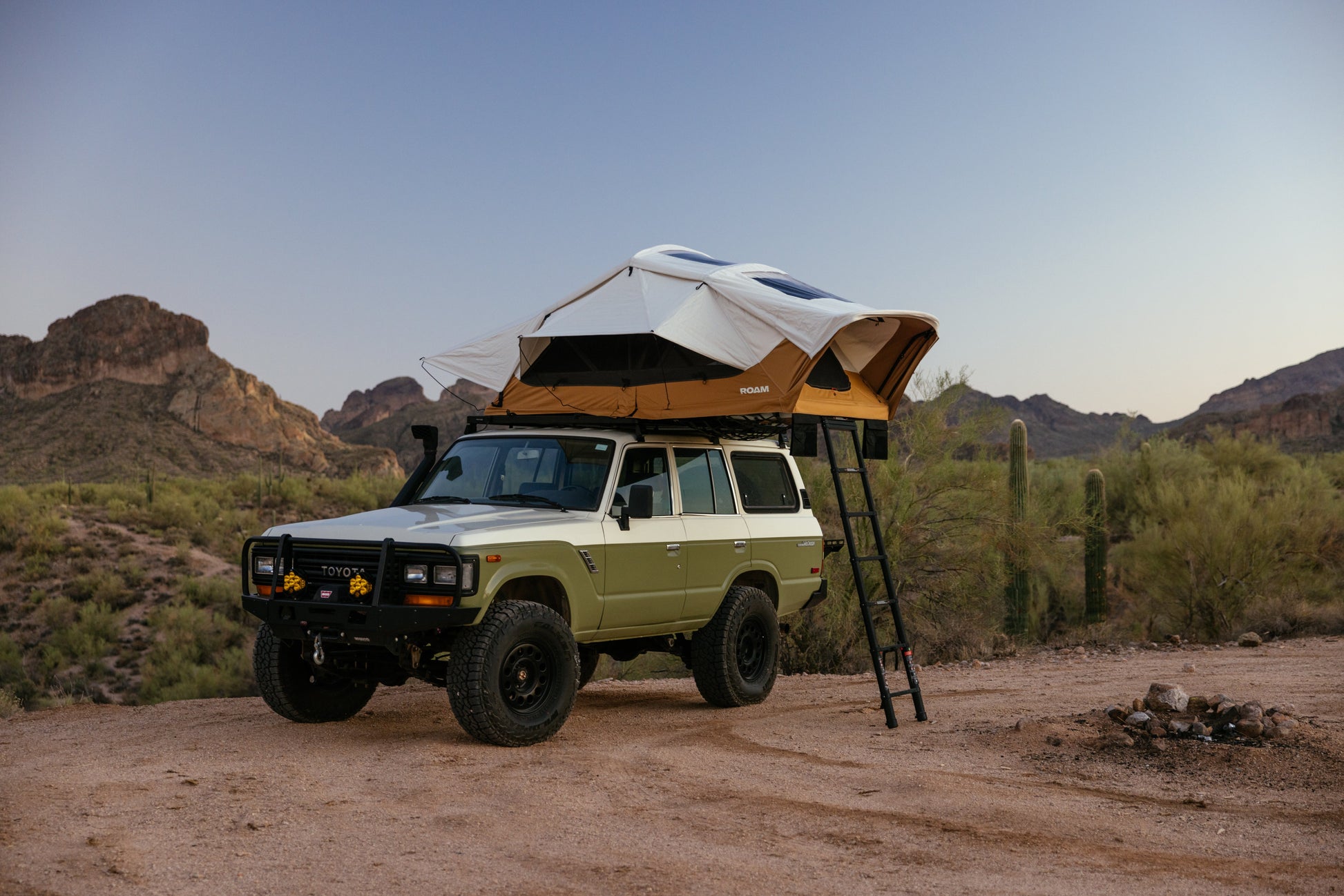 ROAM Vagabond XL 2.0 in Sand, open on a green Land Cruiser