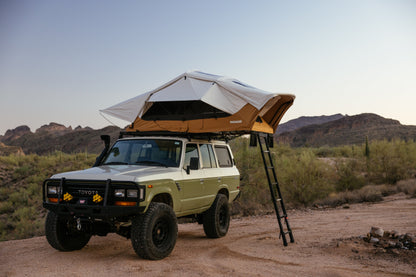 ROAM Vagabond XL 2.0 in Sand, open on a Land Cruiser with the ladder down