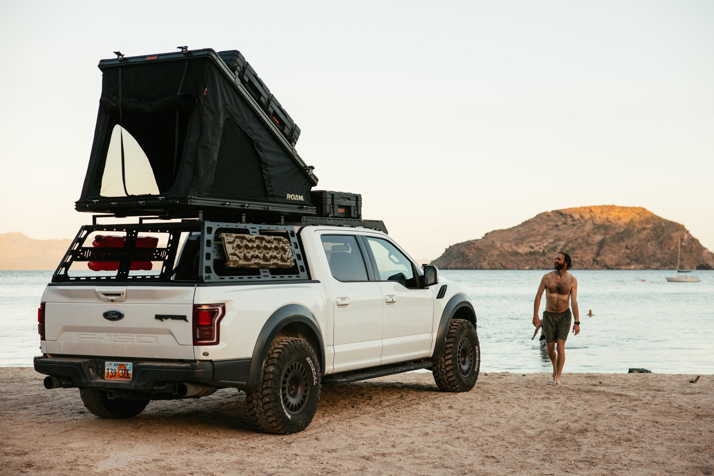 ROAM Desperado open on a Ford Raptor at the shoreline