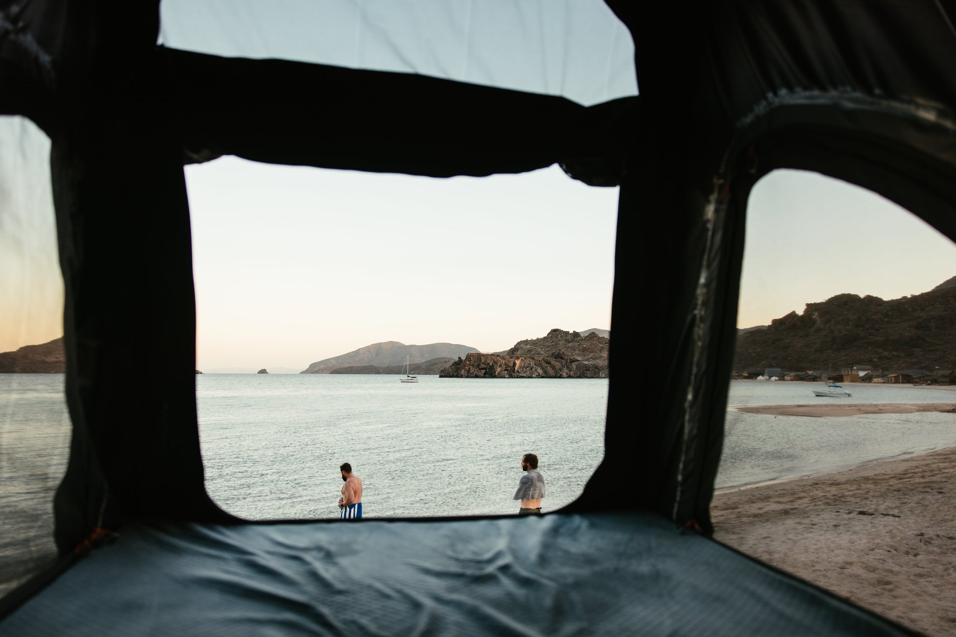 Looking out of the ROAM Desperado across a beach