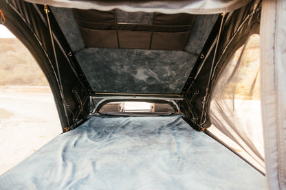 Inside the ROAM Desperado showing the mattress and interior