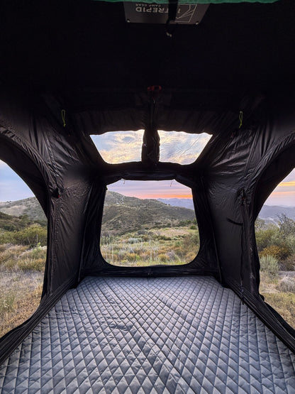 Inside the Intrepid Geo 2.5 looking out of the rear window at sunset