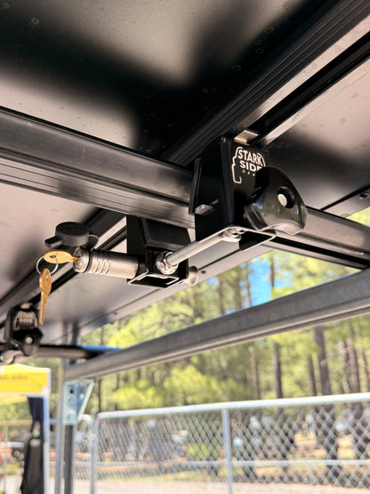 A Stark Side Gear mount fitted to a crossbar with the tent lock inserted