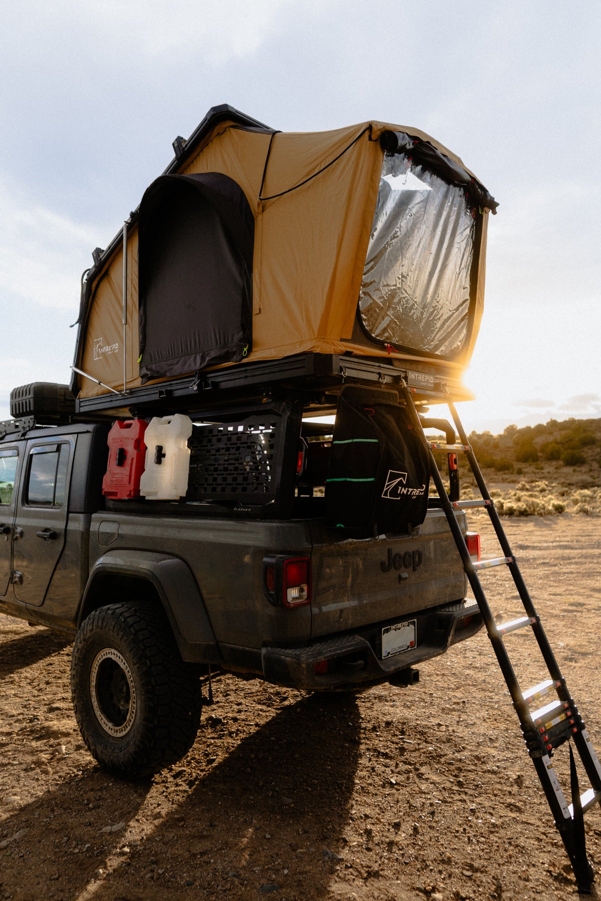 Intrepid Geo 2.5 Pro in Coyote Brown with the ladder down, on a Jeep Gladiator