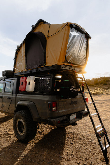 Intrepid Geo 2.5 Pro in Coyote Brown with the ladder down, on a Jeep Gladiator