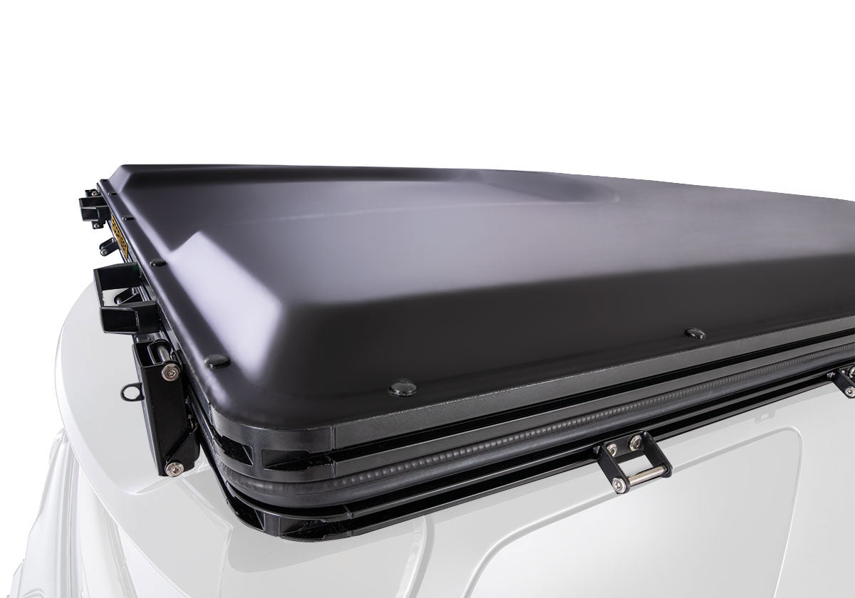 Roofnest Falcon 3 EVO closed on a white vehicle, three-quarter view
